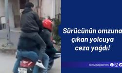 Sürücünün omzuna çıkan yolcuya ceza yağdı!